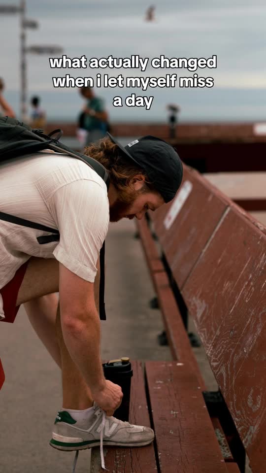 Slideshow cover over a phone photo of a runner tying a shoe: what actually changed when I let myself miss a day